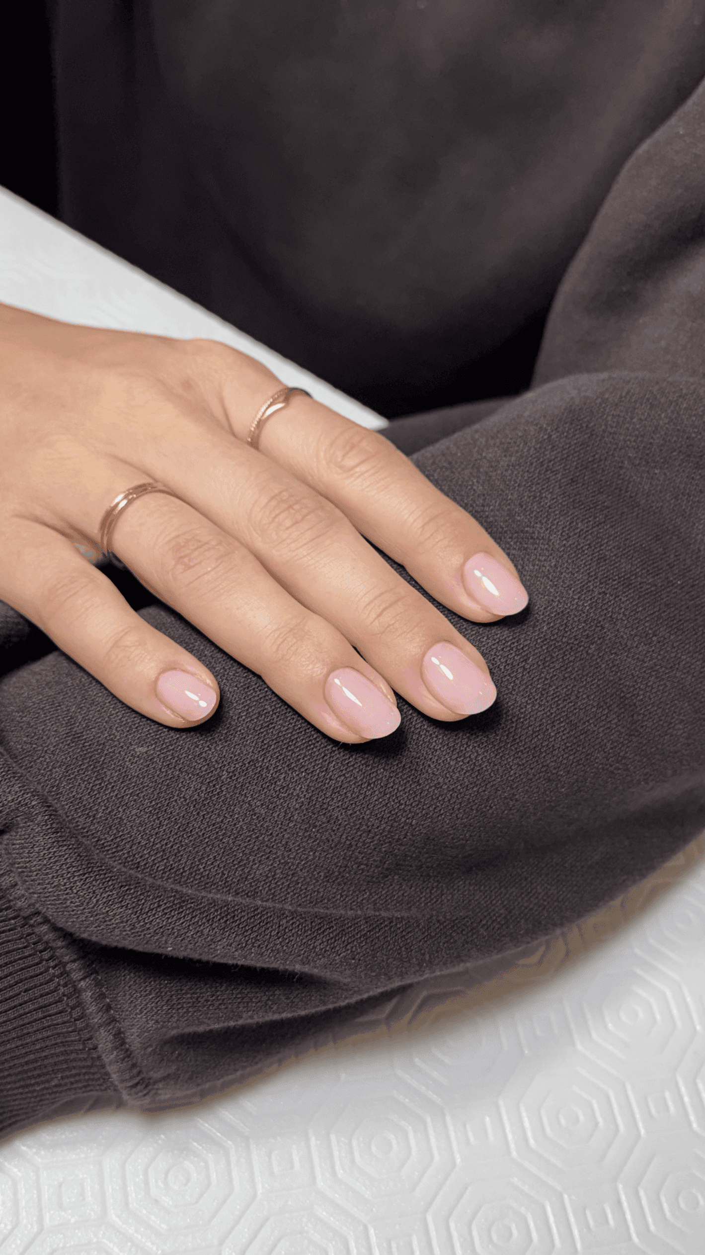 Close-up of premium Russian manicure with nude polish